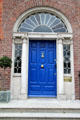 Blue Georgian door of Liberator Daniel O'Connell house on Merrion Square. Dublin, Ireland.