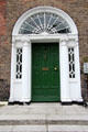 Black Georgian door of Mathematician John Lighton Synge house on Merrion Square. Dublin, Ireland.