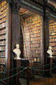 Shelves of Old Trinity Library with busts of famous thinkers. Dublin, Ireland.