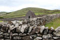 Gallarus Oratory which resembles a small inverted boat on Dingle Peninsula. Ireland.