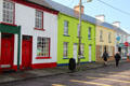Streetscape of colorful houses facing South Square of Sneem. Sneem, Ireland