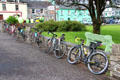 Bicyclists rest on South Square of Sneem. Sneem, Ireland.