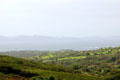View though mist towards ocean & hills from Staigue Fort on Ring of Kerry. Ireland.