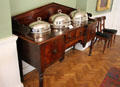 Covered silver platters on sideboard at Derrynane House. Ireland.