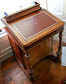 Davenport writing desk with hinged desktop in library at Derrynane House. Ireland.