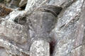 Carved Sheela-na-Gig female figure to keep evil spirits away at Boyle Abbey. Knocknashee, Ireland.