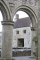 Nave arch with Gatehouse beyond at Boyle Abbey. Knocknashee, Ireland.