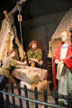 Display depicting stone carvers at Clonmacnoise museum. Ireland.