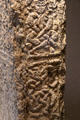 Human figure detail on North Cross at Clonmacnoise museum. Ireland.
