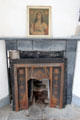Fireplace & religious art in Matron's quarters at Irish Workhouse Centre. Portumna, Ireland.