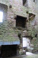 Interior core at Ballyhack Castle with fireplaces & projecting corbels which once supported now missing floors. Ireland.