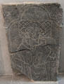 Tomb slab engraved with figure of praying priest at Medieval Mile Museum. Kilkenny, Ireland.