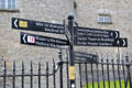 Bilingual directional signs. Kilkenny, Ireland.