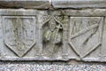 Stone tomb carved with bishop & crests in cathedral at Rock of Cashel. Cashel, Ireland.