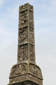 Spire monument with liturgical & Celtic knot carvings at Rock of Cashel. Cashel, Ireland.