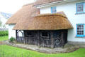 Thatched roof building with rustic front entry. Adare, Ireland.