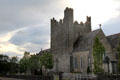 Trinitarian Priory against stormy sky. Adare, Ireland.