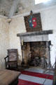 Fireplace & side chair in Earl's private apartments at Bunratty Castle. County Clare, Ireland.