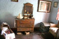 Cradle & dresser in Loop Head House at Bunratty Castle & Folk Park. County Clare, Ireland.