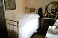 Upscale bedroom in Golden Vale Farmhouse at Bunratty Castle & Folk Park. County Clare, Ireland.