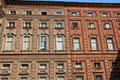 Brick courtyard facade of Palazzo Carignano. Turin, Italy.