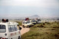 Tourists watching animals from safety of their vehicles in Amboseli National Park. Kenya.