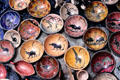 Painted clay dishes with animal themes at a crafts market near Nairobi. Kenya.