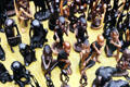 Carved seated ebony Africans at a crafts market in Nairobi suburbs. Kenya.