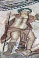 Roman mosaic floor detail with image of man with staff at Volubilis. Morocco
