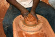 Artisan throws pottery at pottery center. Trois Islet, Martinique.
