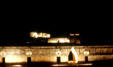 Pre-Colombian architecture of Mayan site of Uxmal floodlit at night. Mexico.