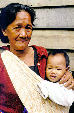 Woman holding infant in Kemabong. Malaysia.