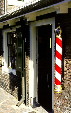 Barber shop, with spiral pole, near Haarlem town square. Haarlem, Netherlands.