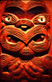 Wooden Maori relief with jeweled eyes at War Memorial Museum. Auckland, New Zealand.