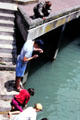 Fishing from the dock at Ferry building. Auckland, New Zealand.