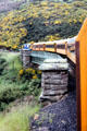 Taieri Gorge Rail Road crosses small bridge. New Zealand.