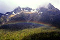 Rainbow in mountains near Milford Sound. New Zealand.