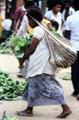 Woman carrying her purchases from her head at a market in Port Moresby. Papua New Guinea