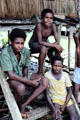 Boys sitting on the steps of a house in Mendam. Papua New Guinea.