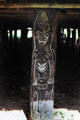 Carved post holding up the house Tambaran in Angoram. Papua New Guinea.