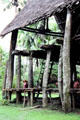 Tall carved support posts of a house Tambaran in Palembei. Papua New Guinea.