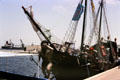 Small sailing ship with figurehead in port. Sousse, Tunisia.
