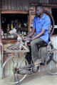 Knife sharpener pedeling modified bicycle in Mto Wa Mbu. Tanzania