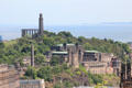 Calton Hill with National Monument, Nelson Monument, obelisk Political Martyrs Monument, & St Andrew's House government building. Edinburgh, Scotland.