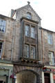 Carved building with archway to Sugarhouse Close off Canongate St. Edinburgh, Scotland.