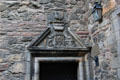 Museum of Edinburgh carved doorway pediment on courtyard off Bakehouse Close. Edinburgh, Scotland.