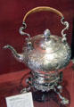 Silver tea kettle on stand engraved with city arms by William Gilchrist of Edinburgh at Museum of Edinburgh. Edinburgh, Scotland.