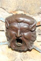 Bronze well head mouth piece in front of John Knox House. Edinburgh, Scotland.