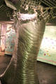 Model of Brontosaurus leg breaking through ceiling at Our Dynamic Earth. Edinburgh, Scotland.
