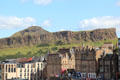 Salisbury Crags & Arthur's Seat over roofline of Edinburgh. Edinburgh, Scotland